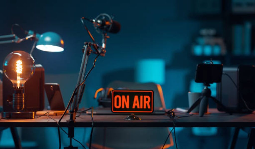 Live online radio studio desk with on air sign, entertainment and communication concept